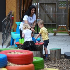 Woman and 2 kids outside